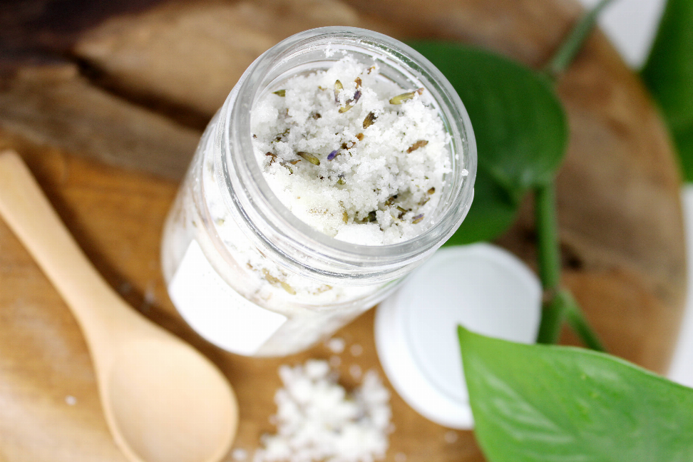 Jar of organic French lavender sugar scrub with visible scrub crystals and buds