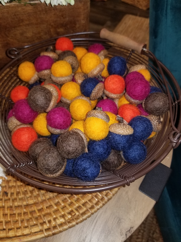 Felt wool acorns, assorted colors, in a basket bowl