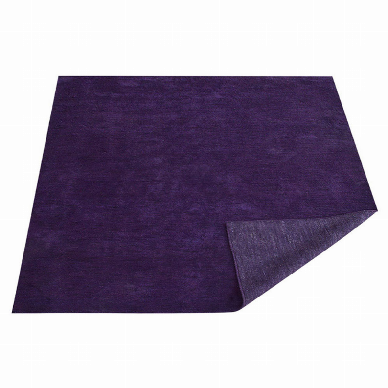 Hand-knotted silk square rug, solid dark purple with visible folded corner edge