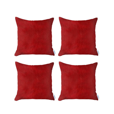 Set of four red faux leather square throw pillows with textured finish
