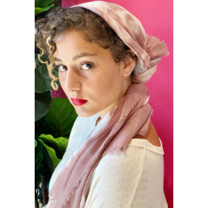 Mauve tie-dye scarf with soft fringe, worn around the neck