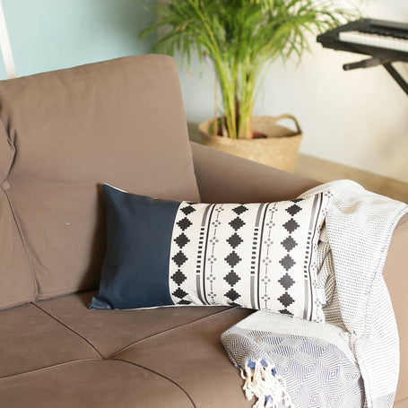 Navy blue faux leather pillow cover with white center panel and black diamond ornament pattern