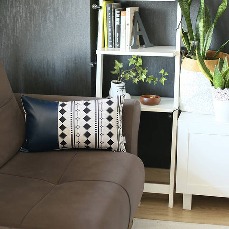 Navy blue faux leather pillow cover with white band and black cross-diamond pattern