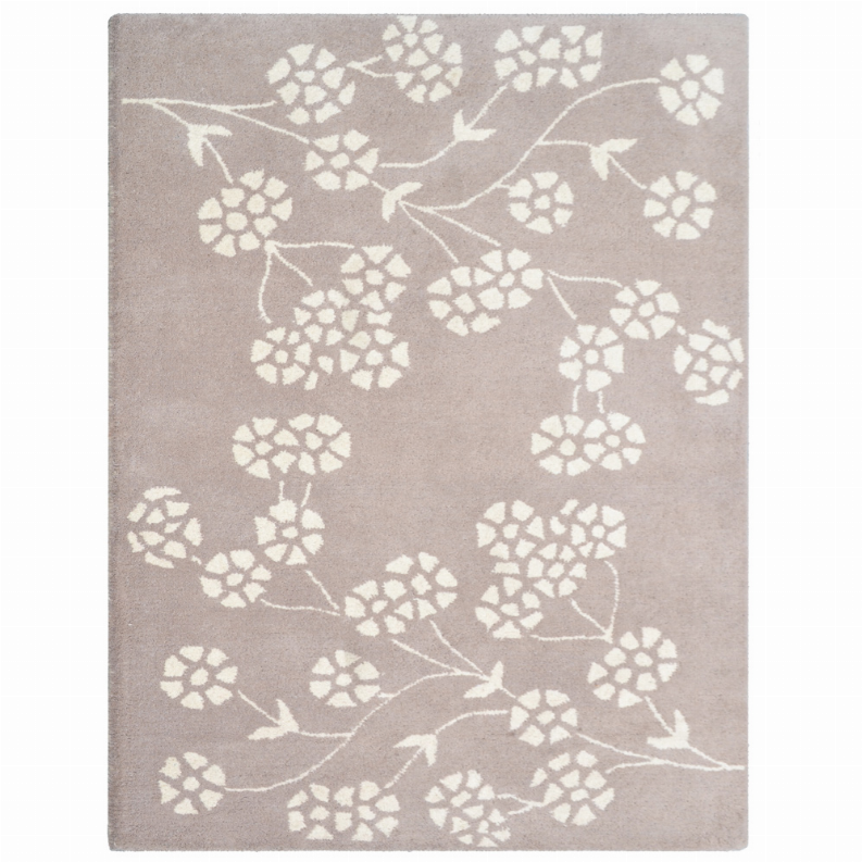 Taupe hand-tufted wool rug with all-over white floral medallions pattern