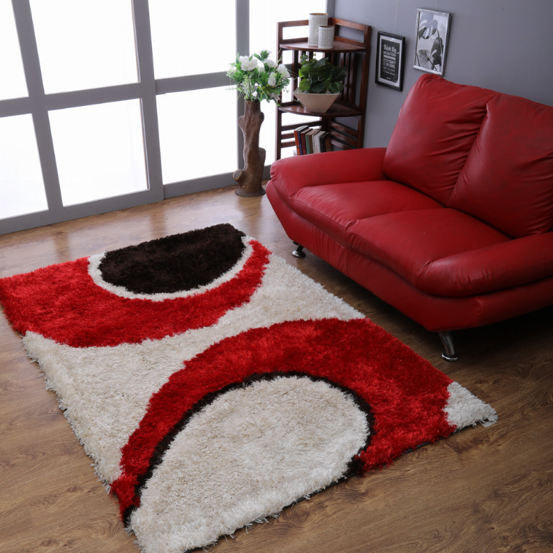 Contemporary shag area rug with red and white geometric arches and black outlines