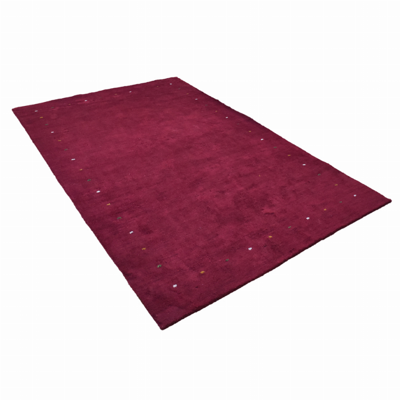 Maroon speckled area rug with low textured pile, angled view