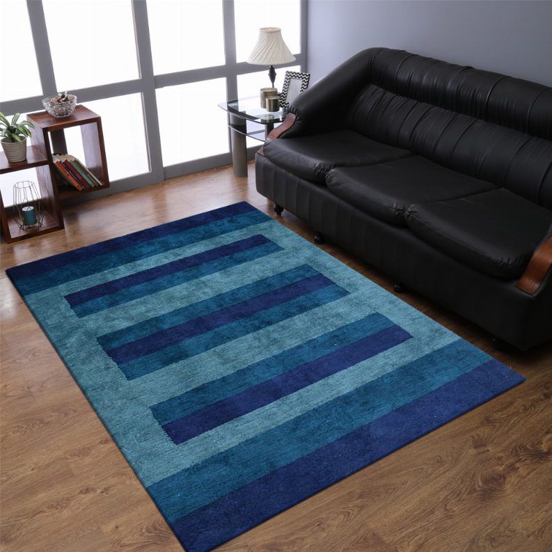 Hand-knotted silk blend area rug with horizontal stripe pattern in blue, teal, and navy