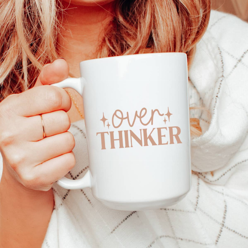 Ceramic coffee mug with rose-gold text "Over Thinker" and sparkles
