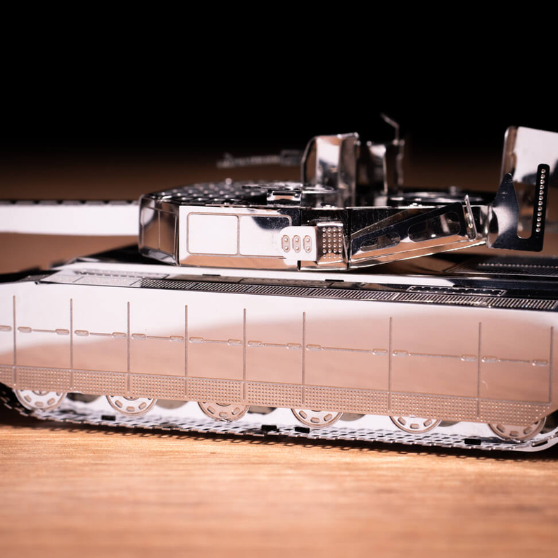 Metal tank model with open top and turret details, gray and silver metal pieces