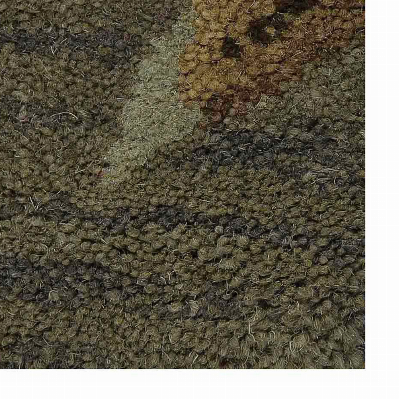 Textured close-up of hand-tufted wool rug pile in olive green and dark brown