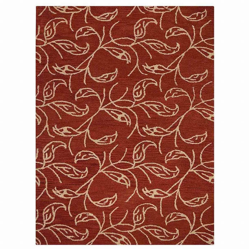 Rust red rug featuring cream leaf-and-bird linework pattern in dense repeat.