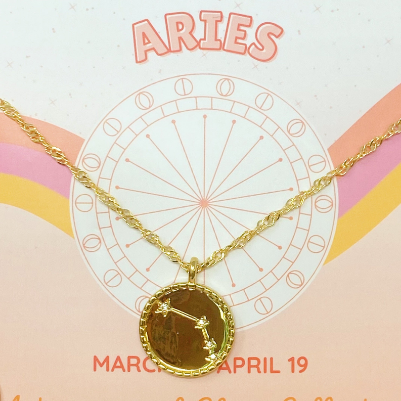 Gold-tone link chain necklace with round dark Aries medallion pendant