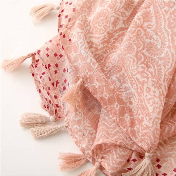Pastel pink voile scarf with tassels and intricate swirls pattern