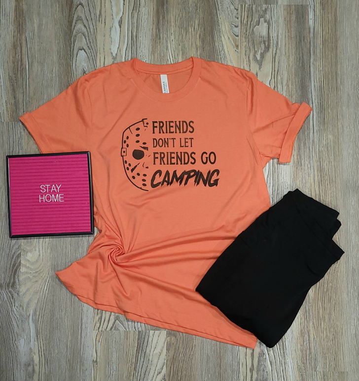 Orange crewneck camping slogan T-shirt with round camera-style graphic