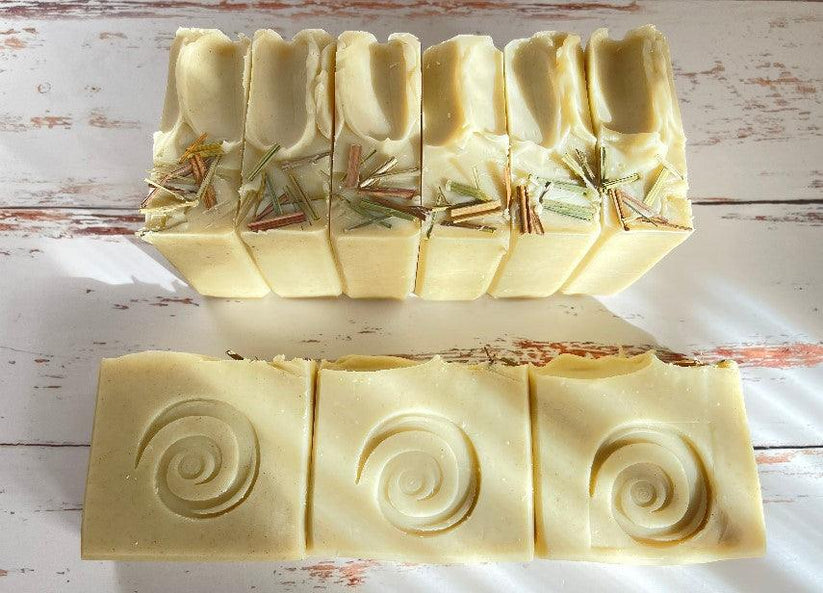 Ivory lemongrass soap bars, embossed spiral swirls and visible herb strands