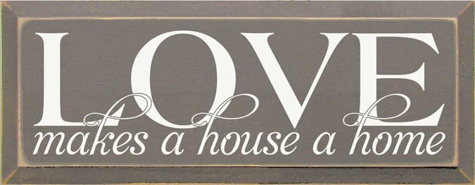 Wooden wall sign with LOVE and 'makes a house a home' quote