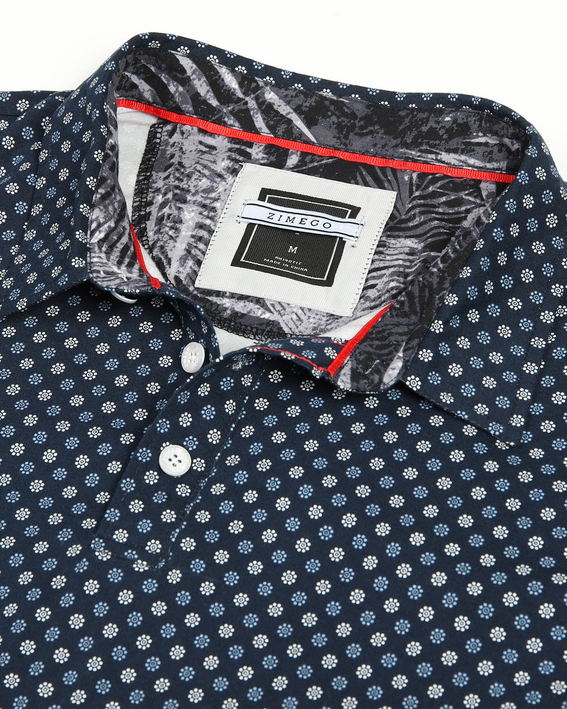 Men's short-sleeve polo shirt in dark navy with white dot pattern, button placket