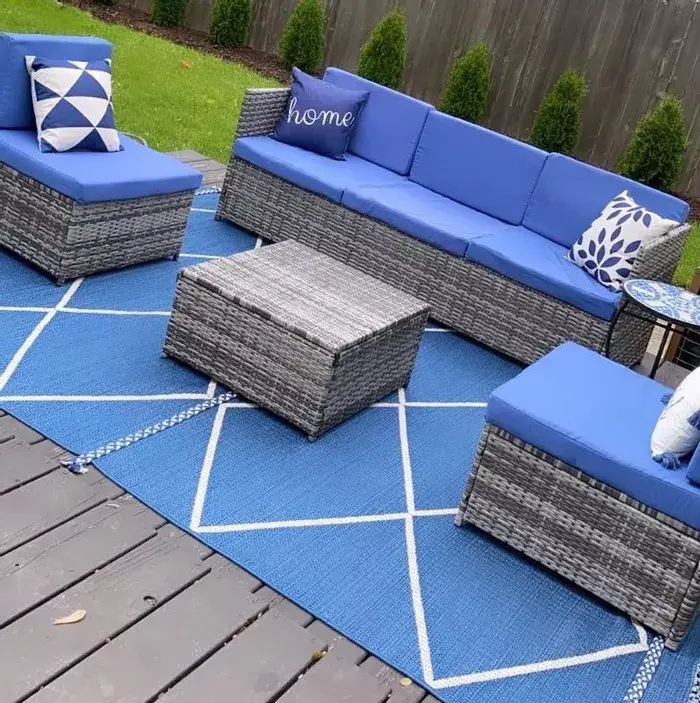 Indigo blue geometric area rug with white grid lines and fringed edges