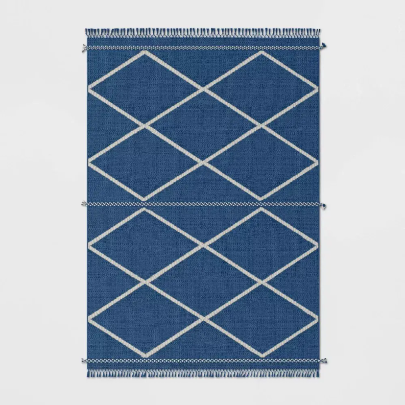 Indigo blue geometric area rug, white diamond lattice, flat weave with fringed border