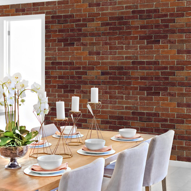 Brick red peel-and-stick wallpaper on accent wall with faux brick texture