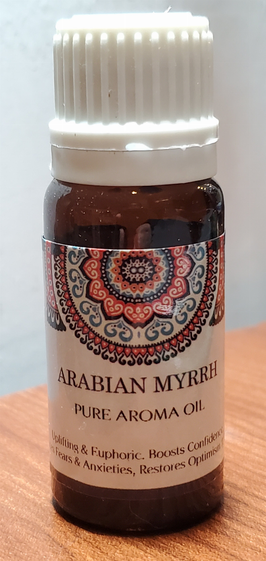 Aromatherapy oil bottle with white cap; Arabian Myrrh label and decorative mandala