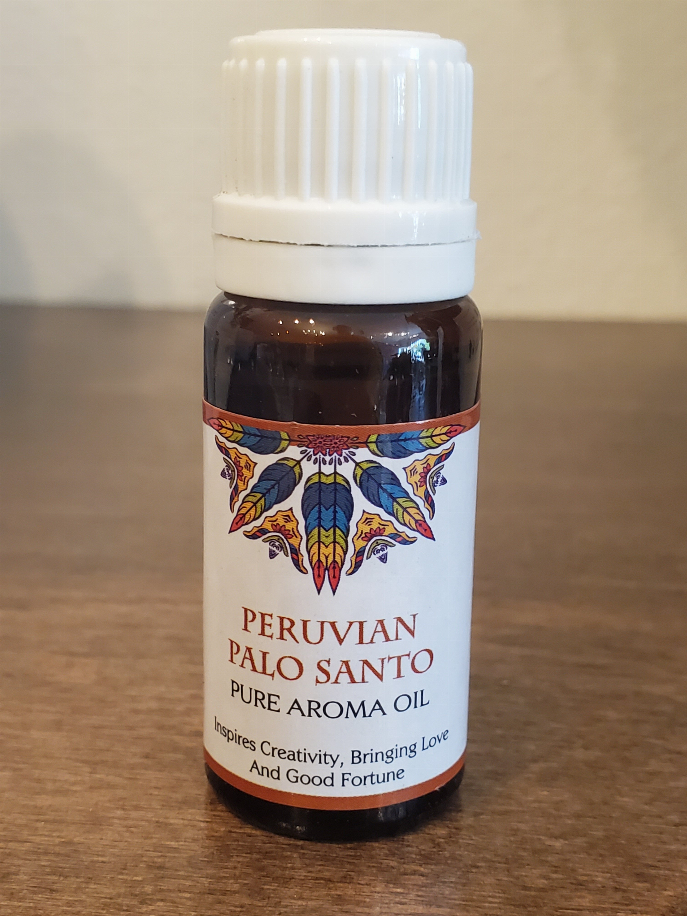 Aromatherapy oil bottle, white ribbed cap; Peruvian Palo Santo label on brown glass