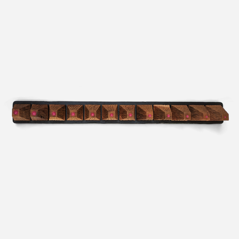 Wood wall art panel, long with patterned panels and rows of purple dowel accents