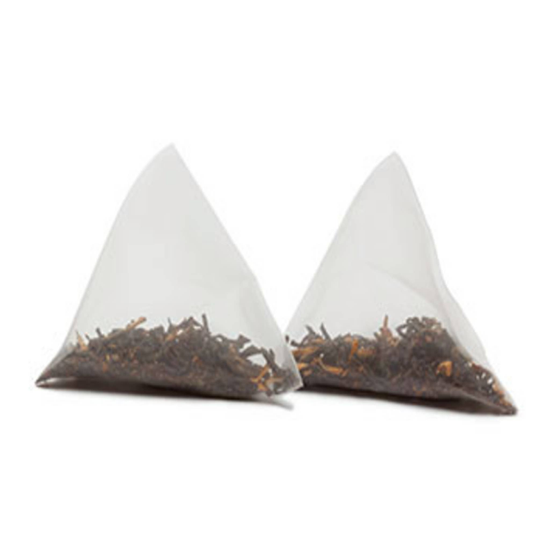 Caffeine-free honeybush banana nut tea sachets, two triangle bags with dark tea