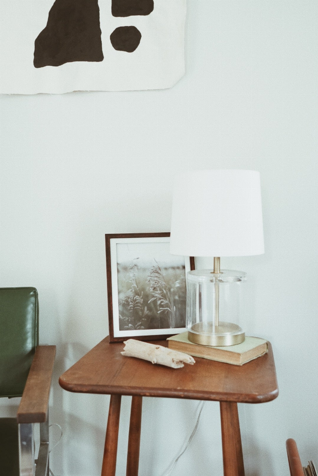 Framed field photo wall art with soft-focus grasses, dark wood frame