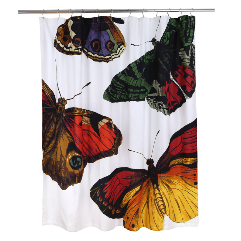 Butterfly shower curtain hanging full view, multicolor moths on white fabric with bottom hem