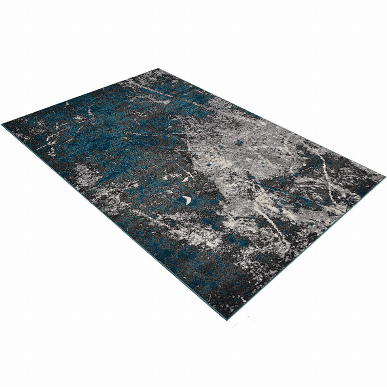 Abstract area rug with blue, teal, and gray distressed pattern, machine woven.
