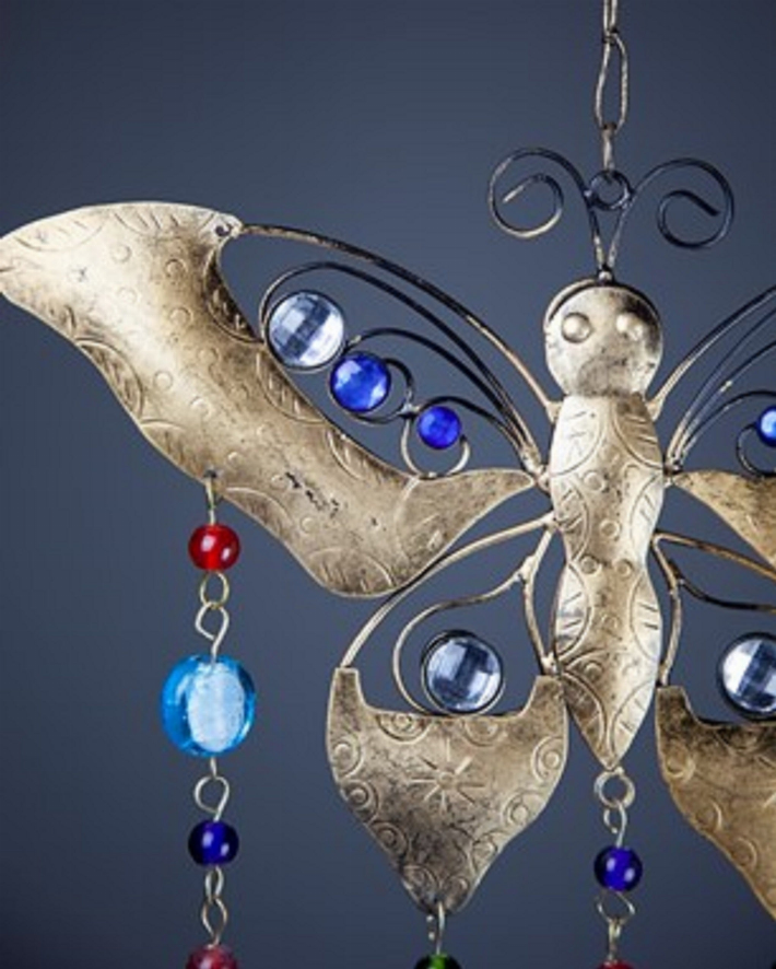 Brass butterfly wind chime with blue glass bead details and hanging bell strands