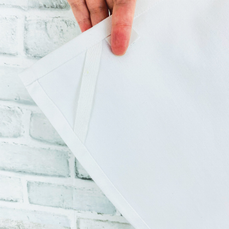 Bright white tea towel with loop, folded corner detail