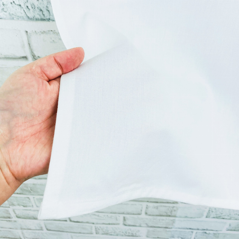 Bright white tea towel with loop, smooth fabric held by hand