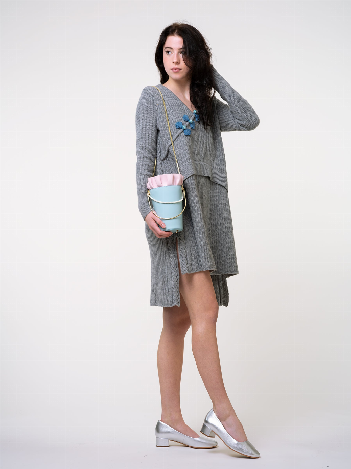 Blue bucket bag with pink ruffle top, gold chain strap and small front clasp
