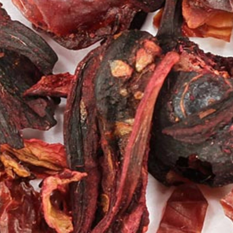 Close-up of red hibiscus berry herbal tea leaf pieces