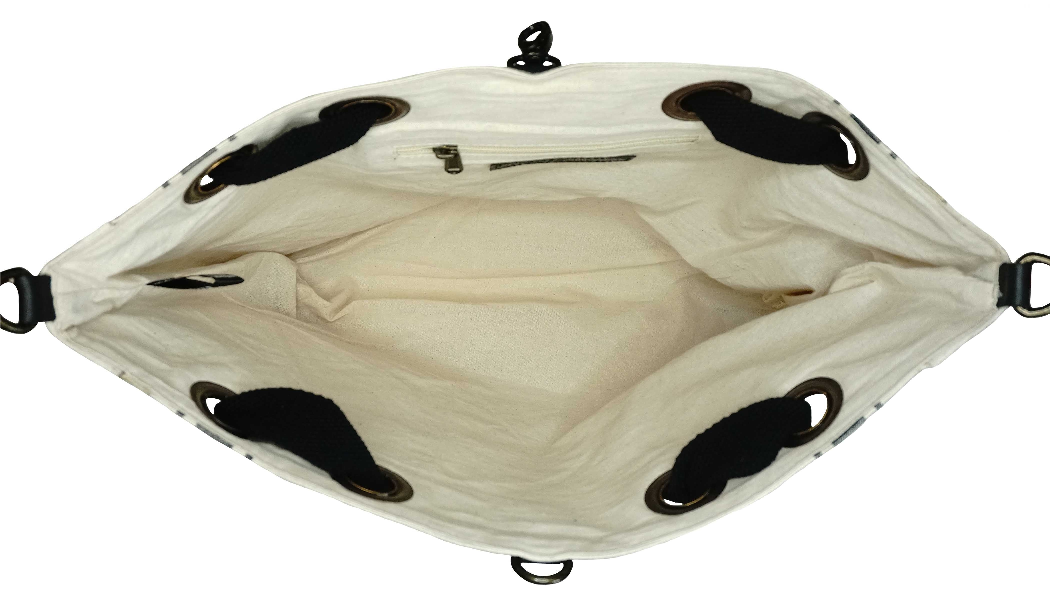 Natural canvas tote interior view with black adjustable straps and open top