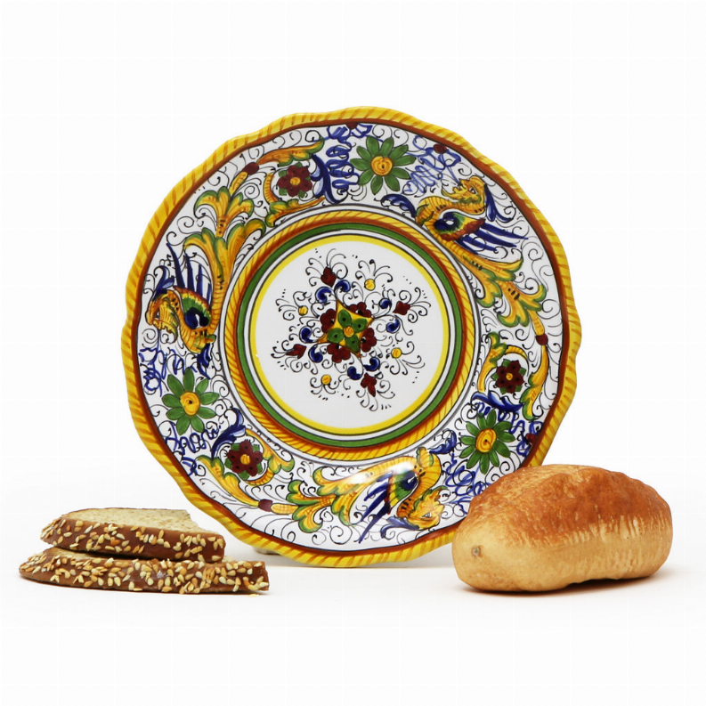 Decorative ceramic bread plate with colorful peacock floral border and yellow rim