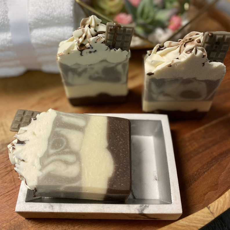 Soap bars in tray, creamy white and dark brown marbled design with chocolate pieces