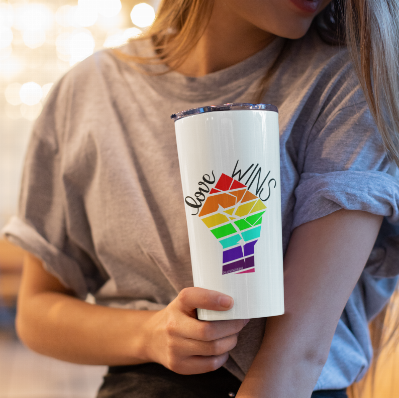 White tumbler with Love Wins rainbow typography and colorful geometric logo