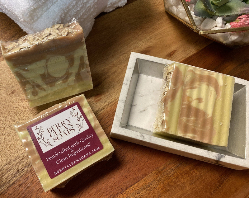 Almond oats soap bars in a gray tray, with a wrapped bar on the side