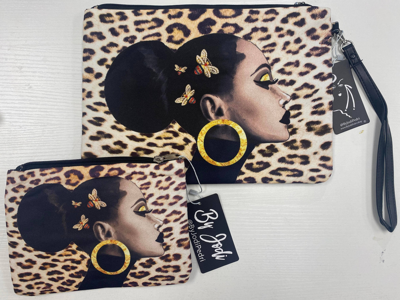 Leopard-print accessory pouch set: large and small; graphic face with gold ring, wrist straps.