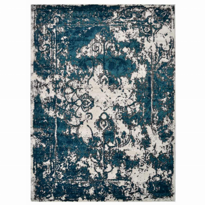 Abstract area rug with teal and off-white medallion and damask-like pattern