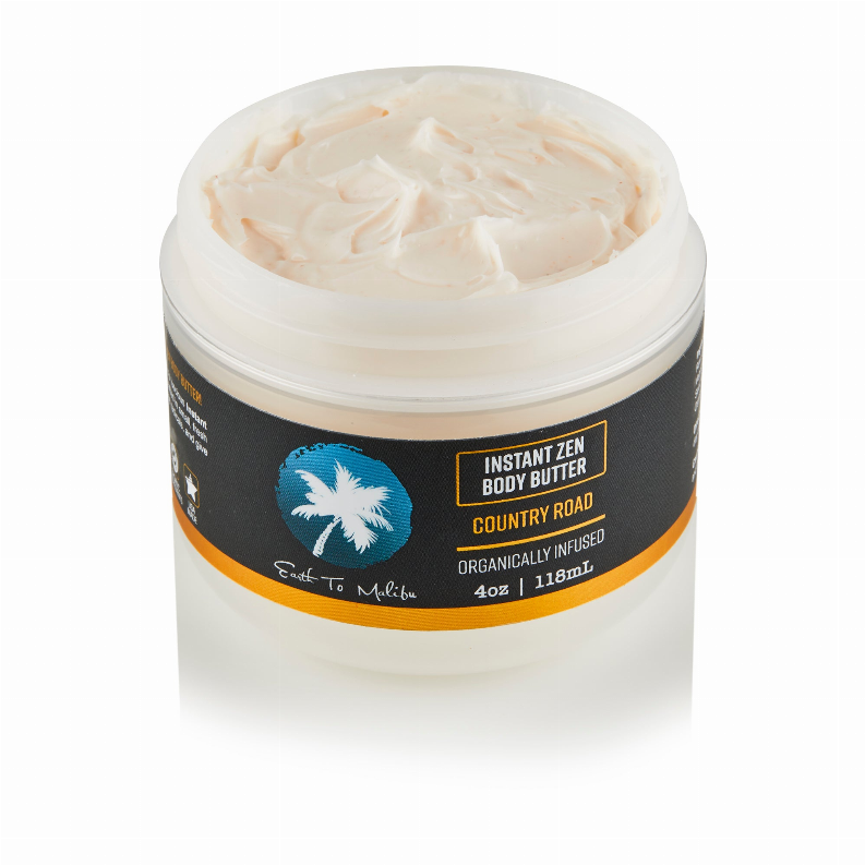 Body butter jar with white lid, Country Road label, creamy beige butter inside.