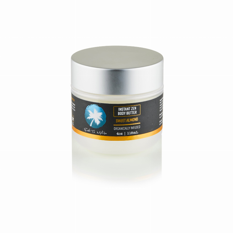 Body butter jar with silver lid, Sweet Almond label, smooth white cream inside.