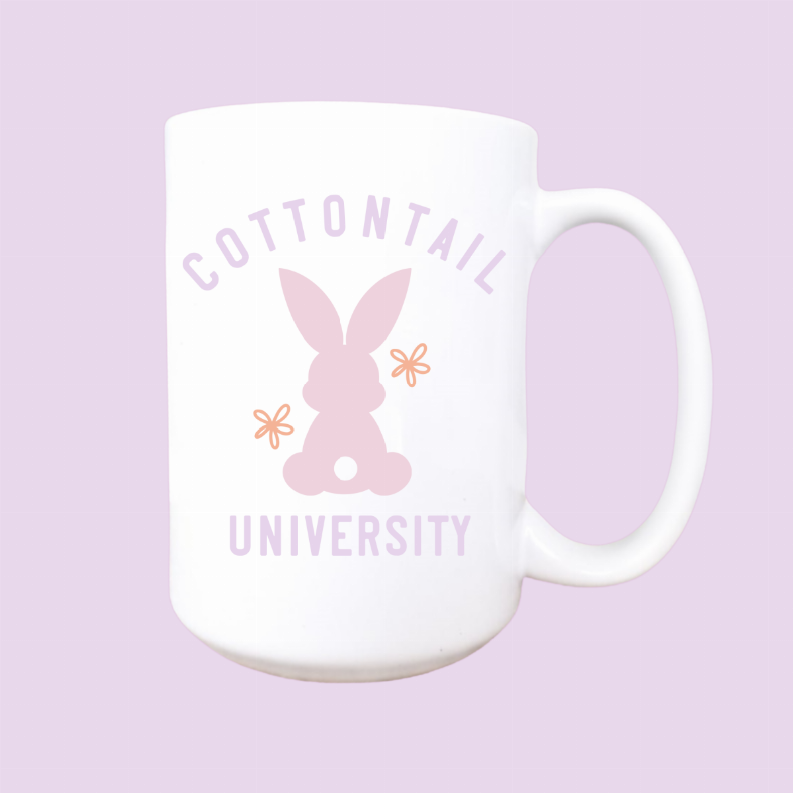 White ceramic Easter mug with pink bunny graphic and 'Cottontail University' lettering