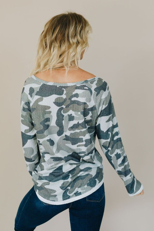 Camo long-sleeve top, scoop neck, angled back view.