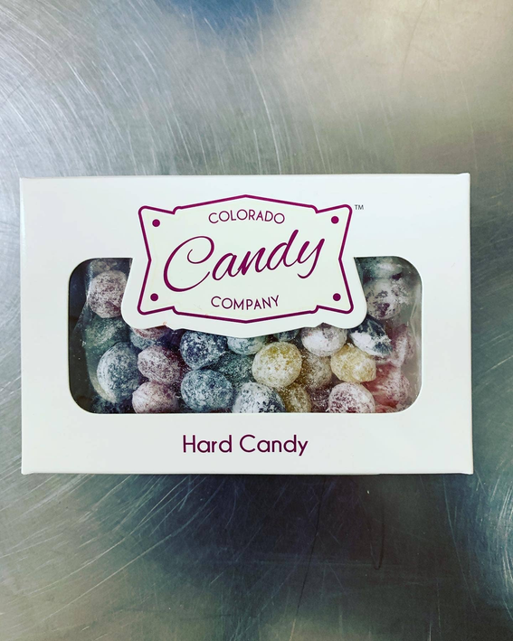 Mixed fruit hard candy box with clear window showing assorted colorful candy pieces