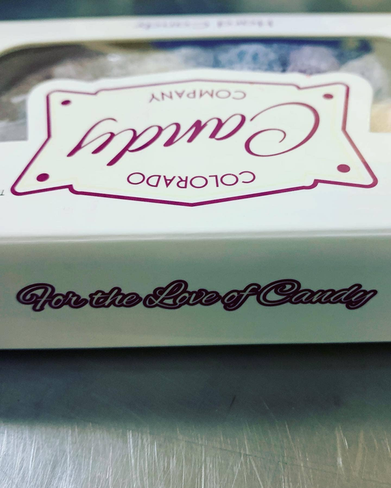 Hard candy box close-up with Colorado Candy Company branding and slogan text