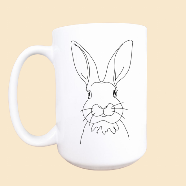 Ceramic Easter coffee mug with white bunny face graphic and rounded handle, 15oz